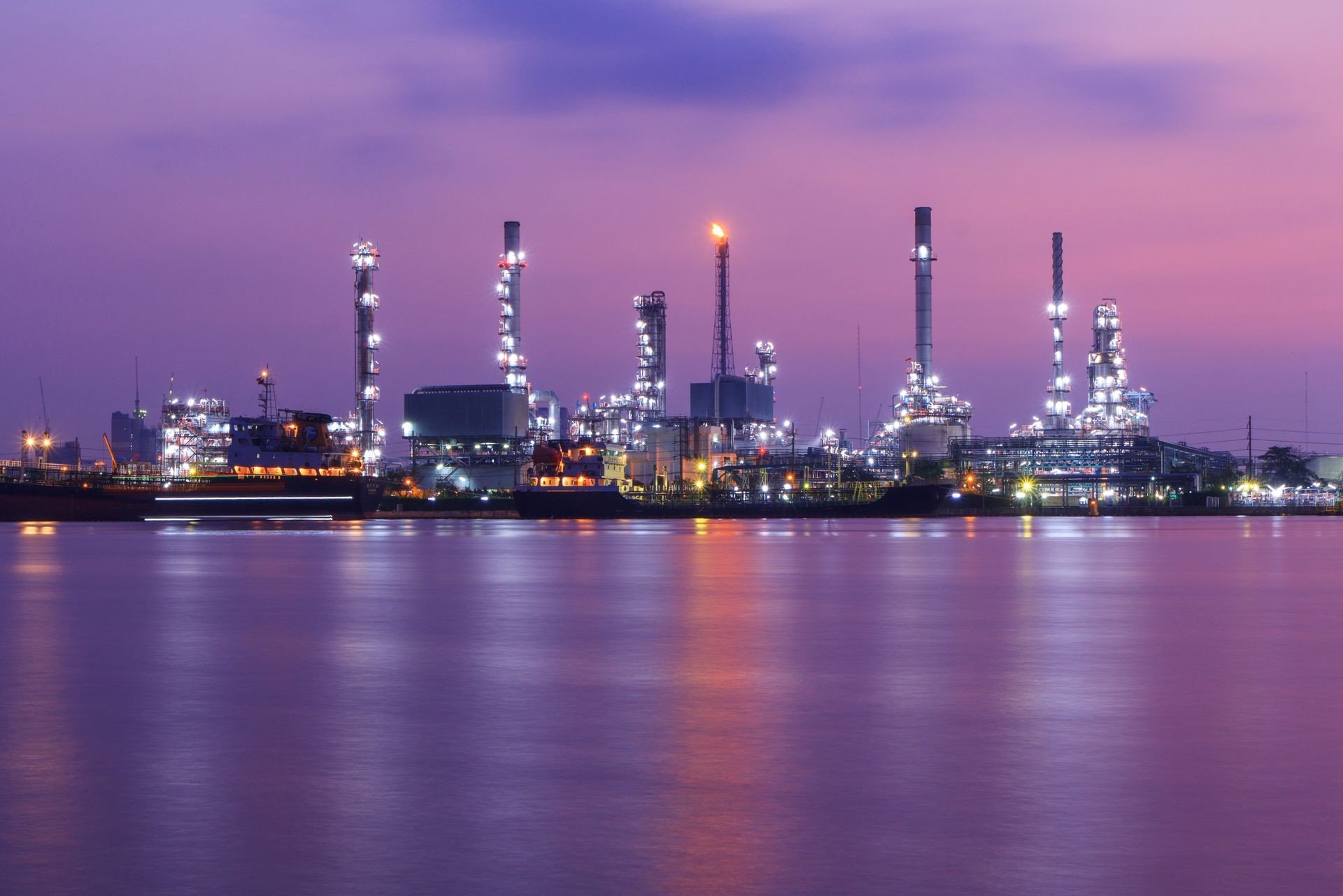 Oil refinery at the river in sunrise time / Big Factory in sunrise time