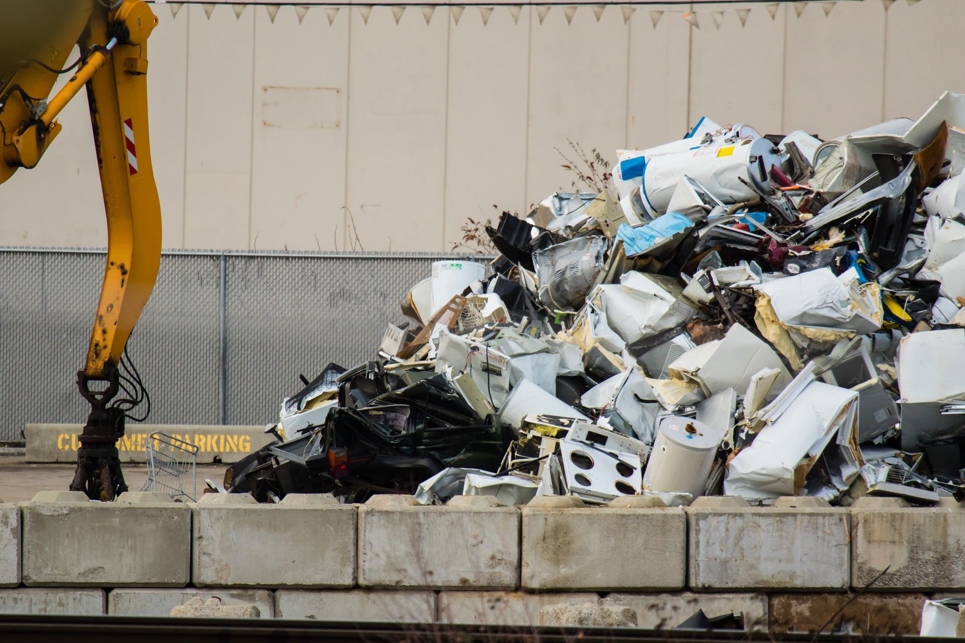 Heap of old scrap metal mainly consist of household appliance in a  scrap yard.